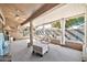 Relaxing sunroom with ceiling fan and comfy seating at 22506 N Mirage Ln, Sun City West, AZ 85375