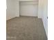 Bright bedroom with neutral carpet, large closet and fresh white paint at 2324 W Luke Ave, Phoenix, AZ 85015