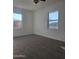 Bright bedroom featuring new carpet, two windows, and freshly painted white walls at 2324 W Luke Ave, Phoenix, AZ 85015