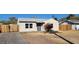 Inviting single-level home with a well-maintained driveway and a tidy front landscape at 2324 W Luke Ave, Phoenix, AZ 85015