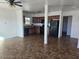 Open-concept kitchen featuring black appliances, wooden cabinets and tile flooring at 2324 W Luke Ave, Phoenix, AZ 85015