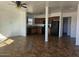 Open-concept kitchen featuring black appliances, wooden cabinets and tile flooring at 2324 W Luke Ave, Phoenix, AZ 85015