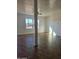 Spacious living room featuring tile floors, a ceiling fan, and natural light from large windows at 2324 W Luke Ave, Phoenix, AZ 85015