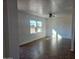 Bright living room featuring tile floors, a ceiling fan, and natural light from large windows at 2324 W Luke Ave, Phoenix, AZ 85015