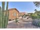 Partial view of backyard with patio and desert plants at 2409 E Antigua Dr, Casa Grande, AZ 85194