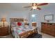 Spacious bedroom with a queen-size bed and ensuite access at 2409 E Antigua Dr, Casa Grande, AZ 85194