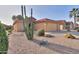 House exterior showcasing desert landscaping and a garage at 2409 E Antigua Dr, Casa Grande, AZ 85194