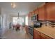 Inviting kitchen features warm wood cabinets and a breakfast nook at 2409 E Antigua Dr, Casa Grande, AZ 85194