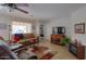 Living room with flat-screen TV, fireplace, and comfy seating at 2409 E Antigua Dr, Casa Grande, AZ 85194