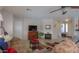 Living room with tiled floors, brown couches, and a view of the kitchen at 2409 E Antigua Dr, Casa Grande, AZ 85194