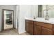 Elegant bathroom with double vanity and large mirror at 2427 W Kowalsky Ln, Phoenix, AZ 85041