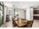 Open concept dining area with adjacent kitchen access at 2427 W Kowalsky Ln, Phoenix, AZ 85041