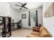 Bright home office with built-in shelving and a desk at 2427 W Kowalsky Ln, Phoenix, AZ 85041