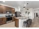 Modern kitchen with stainless steel appliances and an island at 2427 W Kowalsky Ln, Phoenix, AZ 85041