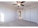 Bedroom with ceiling fan and double door closet at 2438 W Gambit Trl, Phoenix, AZ 85085