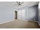 Bedroom with grey walls, carpeting and large closet at 2715 S Rita Ln, Tempe, AZ 85282