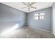 Bedroom with gray walls, carpet, and ceiling fan at 2715 S Rita Ln, Tempe, AZ 85282