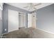 Bedroom with gray walls, carpet and closet at 2715 S Rita Ln, Tempe, AZ 85282