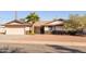 Single story home with attached garage and desert landscaping at 2715 S Rita Ln, Tempe, AZ 85282