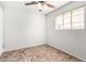 Bedroom with ceiling fan, natural light, and neutral paint at 2906 W Alice Ave, Phoenix, AZ 85051