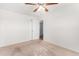 Bright bedroom featuring neutral walls, carpet flooring and a ceiling fan, creating a serene and comfortable atmosphere at 2906 W Alice Ave, Phoenix, AZ 85051