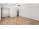 Bright living room featuring a ceiling fan and light-colored paint at 2906 W Alice Ave, Phoenix, AZ 85051