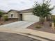 Newly built home with a two-car garage and drought-tolerant landscaping at 3014 N Majestic Ct, Casa Grande, AZ 85122