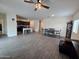 Open kitchen with dark cabinets and island, flows into living and dining area at 3014 N Majestic Ct, Casa Grande, AZ 85122