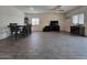 Spacious living room with tile floors, dining area, and a view to backyard at 3014 N Majestic Ct, Casa Grande, AZ 85122