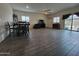 Spacious living room with tile floors, dining area, and sliding glass door to backyard at 3014 N Majestic Ct, Casa Grande, AZ 85122