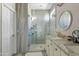 Modern bathroom featuring a glass shower and a double sink vanity at 3021 E Agritopia N Loop, Gilbert, AZ 85296