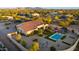 Aerial view of house, pool, and landscaped backyard; expansive desert setting at 30416 N 64Th St, Cave Creek, AZ 85331