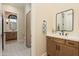 Guest bathroom with single vanity and patterned tile at 30416 N 64Th St, Cave Creek, AZ 85331