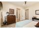 Charming bedroom with rustic dresser and light bedding at 30416 N 64Th St, Cave Creek, AZ 85331