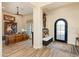 Elegant entryway with a charming bench and rustic wooden desk at 30416 N 64Th St, Cave Creek, AZ 85331