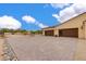 View of the two-car garage and paver driveway at 30416 N 64Th St, Cave Creek, AZ 85331