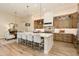 Kitchen with custom cabinetry, large island, and decorative tile backsplash at 30416 N 64Th St, Cave Creek, AZ 85331