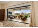 Covered patio with wicker furniture, rug, and view of pool and desert landscape at 30416 N 64Th St, Cave Creek, AZ 85331