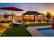 Luxury pool with gazebo, lounge chairs, and artificial turf at 30416 N 64Th St, Cave Creek, AZ 85331