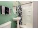 Clean bathroom with a pedestal sink and shower/tub combo at 31292 N Candlewood Dr, San Tan Valley, AZ 85143