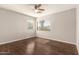 Bright bedroom with wood floors and large window at 31292 N Candlewood Dr, San Tan Valley, AZ 85143