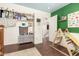 bedroom with green walls and built-in shelves at 31292 N Candlewood Dr, San Tan Valley, AZ 85143