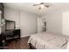 Bedroom with wood floors, window, and workspace at 31292 N Candlewood Dr, San Tan Valley, AZ 85143