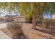 Two-story house with a two-car garage and mature trees at 31292 N Candlewood Dr, San Tan Valley, AZ 85143