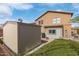 View of the backyard featuring a shed and artificial turf at 3209 W Apollo Rd, Phoenix, AZ 85041