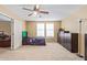 Neutral bedroom with carpet, ceiling fan and access to other rooms at 3209 W Apollo Rd, Phoenix, AZ 85041