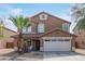 Charming two-story home features a two-car garage, desert landscaping, and a cozy front porch at 3209 W Apollo Rd, Phoenix, AZ 85041