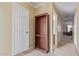 Hallway with built-in bookcase, leading to other rooms at 3209 W Apollo Rd, Phoenix, AZ 85041