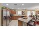 Well-equipped kitchen featuring stainless steel appliances and a functional island with bar seating at 3209 W Apollo Rd, Phoenix, AZ 85041