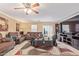 The open living room features tile floors, comfortable seating, and plenty of natural light at 3209 W Apollo Rd, Phoenix, AZ 85041